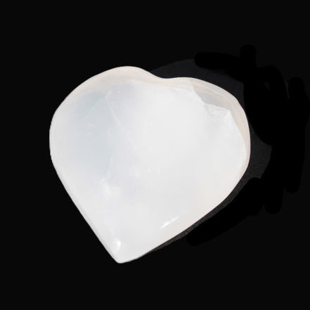Mangano Calcite hand-carved heart 40-49g in sunlight - Rocks and Things Store