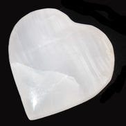 Mangano Calcite hand-carved heart 40-49g in sunlight - Rocks and Things Store