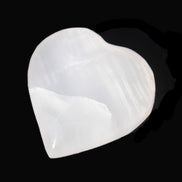 Mangano Calcite hand-carved heart 40-49g in sunlight - Rocks and Things Store