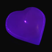 Mangano Calcite hand-carved heart 40-49g in UV light - Rocks and Things Store
