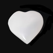 Mangano Calcite hand-carved heart 40-49g in sunlight - Rocks and Things Store