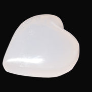 Mangano Calcite hand-carved heart 40-49g in sunlight - Rocks and Things Store