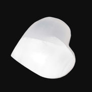 Mangano Calcite hand-carved heart 40-49g in sunlight - Rocks and Things Store