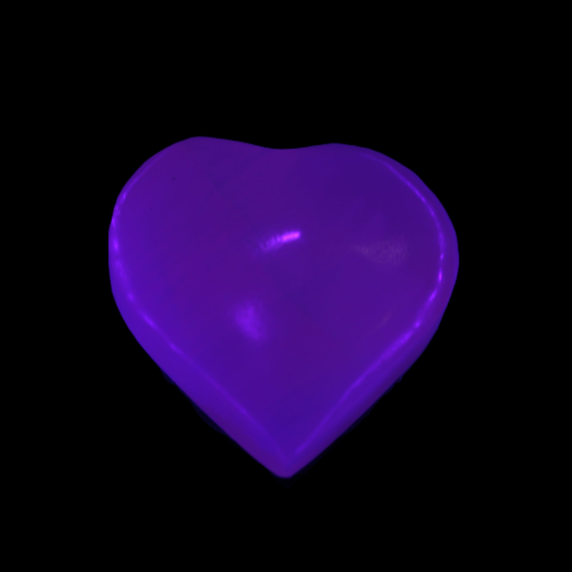 Mangano Calcite hand-carved heart 40-49g in UV light - Rocks and Things Store