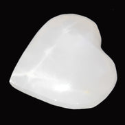 Mangano Calcite hand-carved heart 40-49g in sunlight - Rocks and Things Store