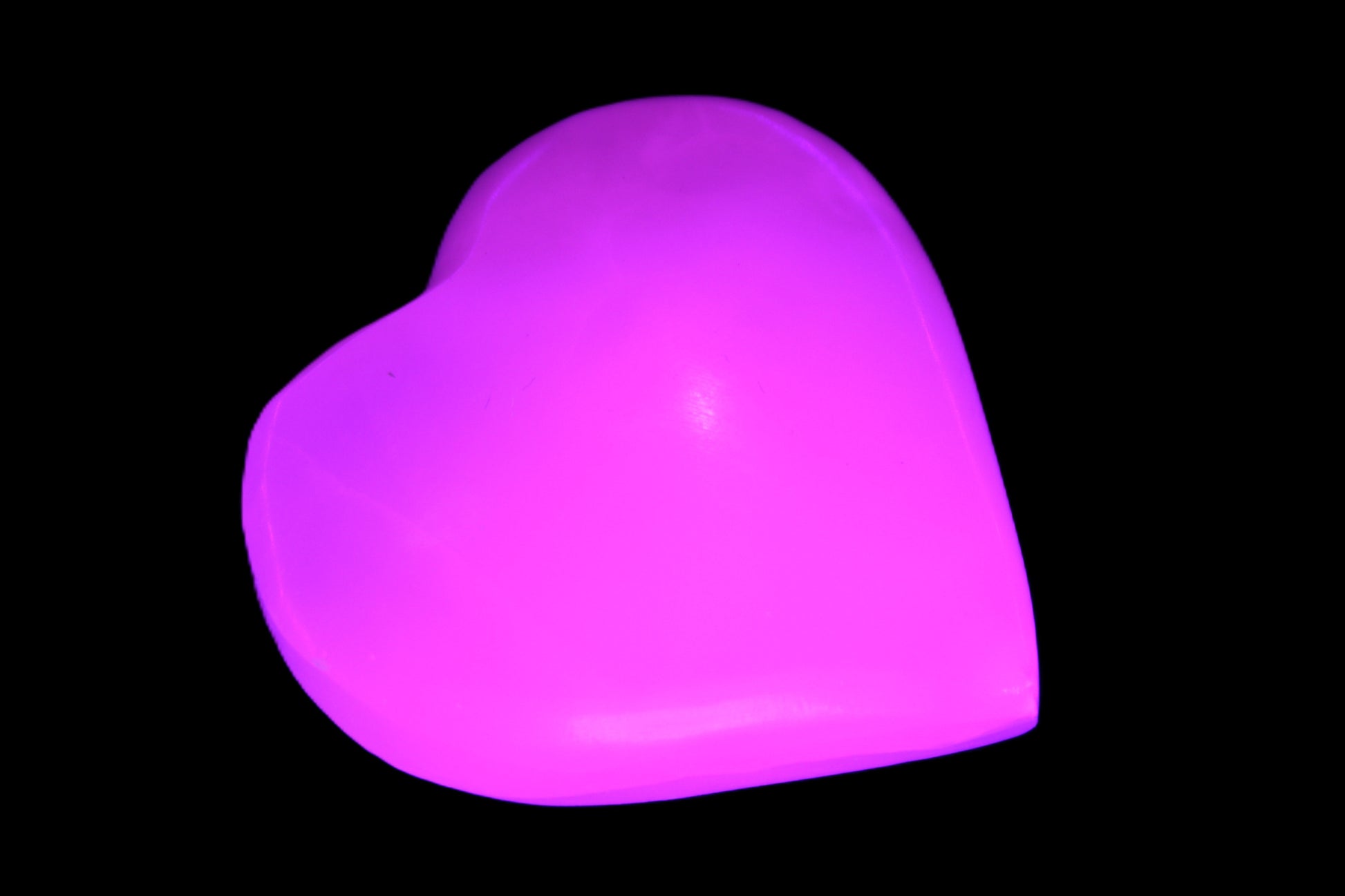 Pink Mangano Calcite 42-45mm in UV light