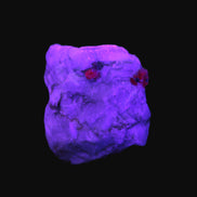 Ruby UV reactive with Muscovite in Marble 255ct 50.9g in UV light - Rocks and Things Store