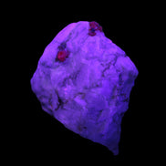Ruby UV reactive with Muscovite in Marble 255ct 50.9g in UV light - Rocks and Things Store
