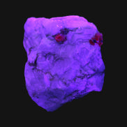 Ruby UV reactive with Muscovite in Marble 255ct 50.9g in UV light - Rocks and Things Store
