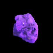 Aquamarine with three Micas in Feldspar matrix 311ct 62.3g in UV light - Rocks and Things Store