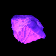 Multi-coloured Green Tourmaline crystal 43.4ct 8.7g in UV light