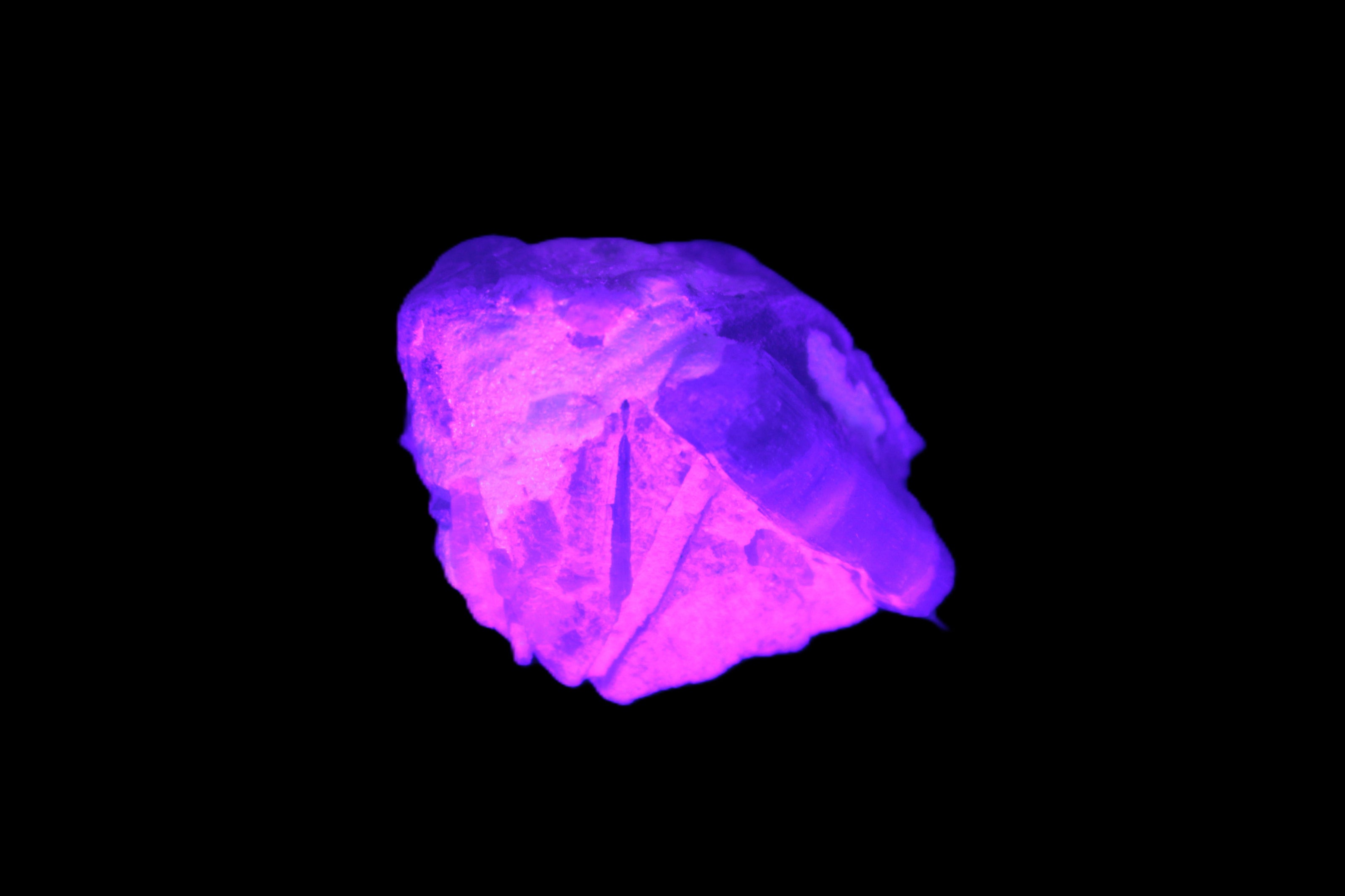 Multi-coloured Green Tourmaline crystal 43.4ct 8.7g in UV light