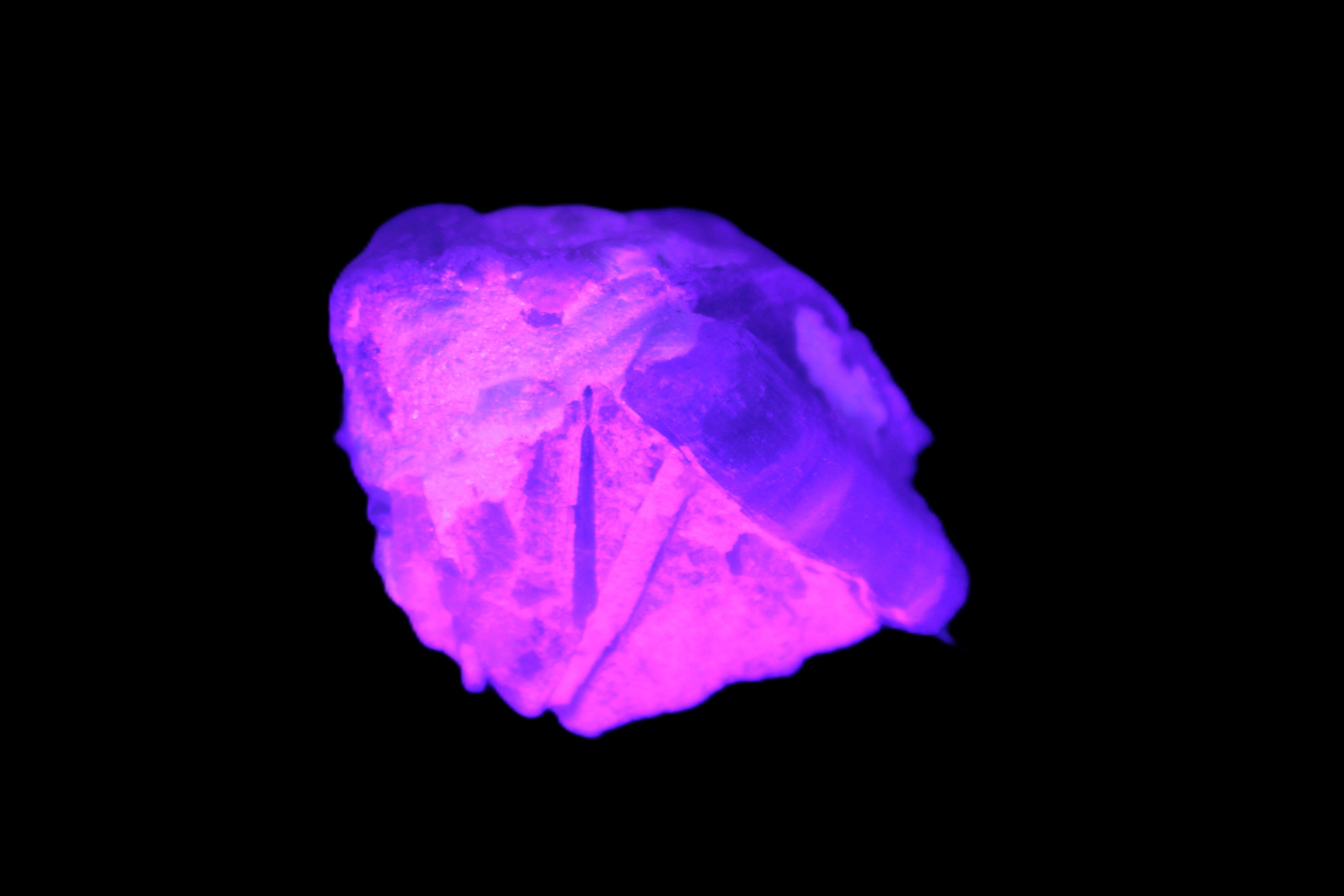 Multi-coloured Green Tourmaline crystal 43.4ct 8.7g in UV light