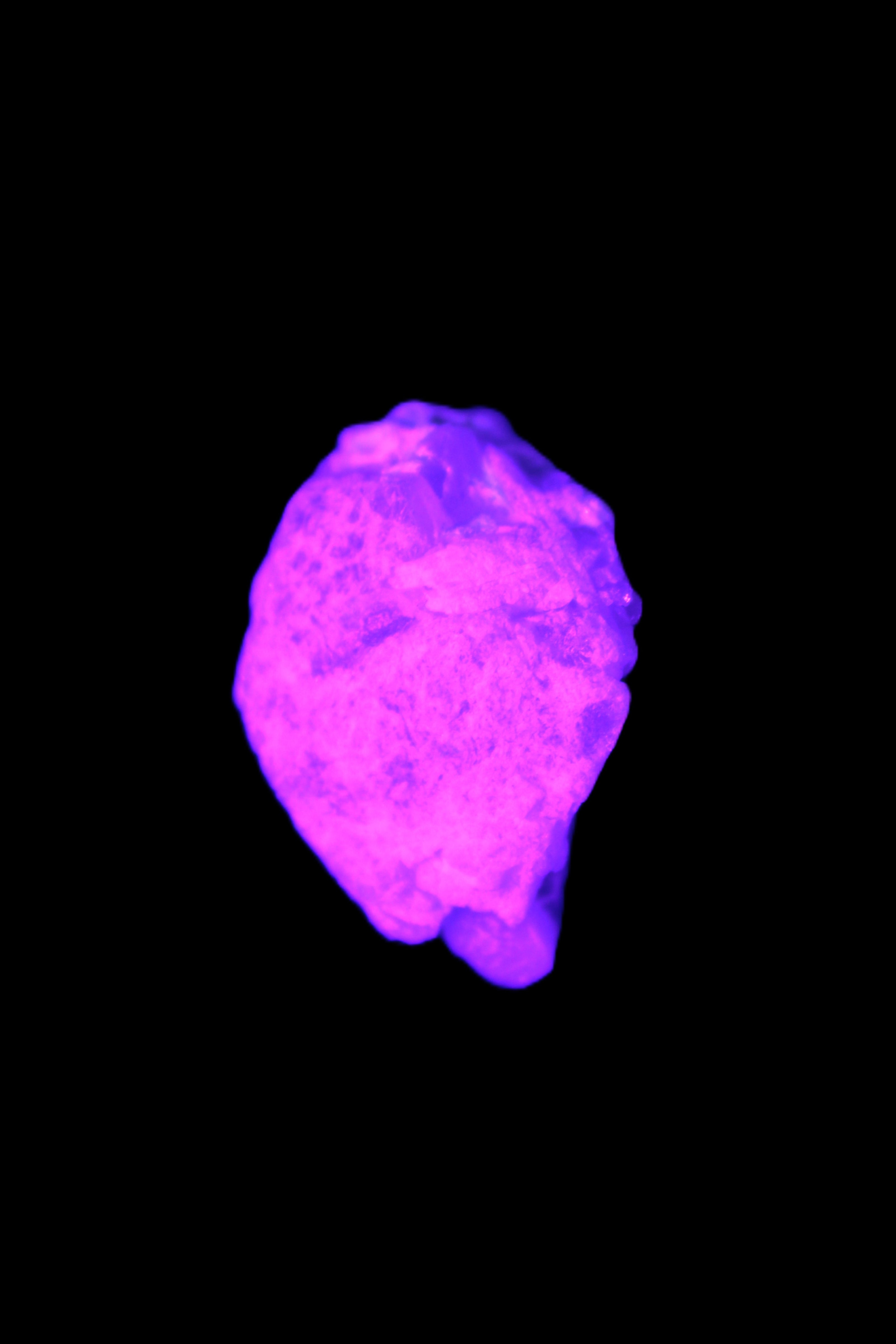 Multi-coloured Green Tourmaline crystal 43.4ct 8.7g in UV light