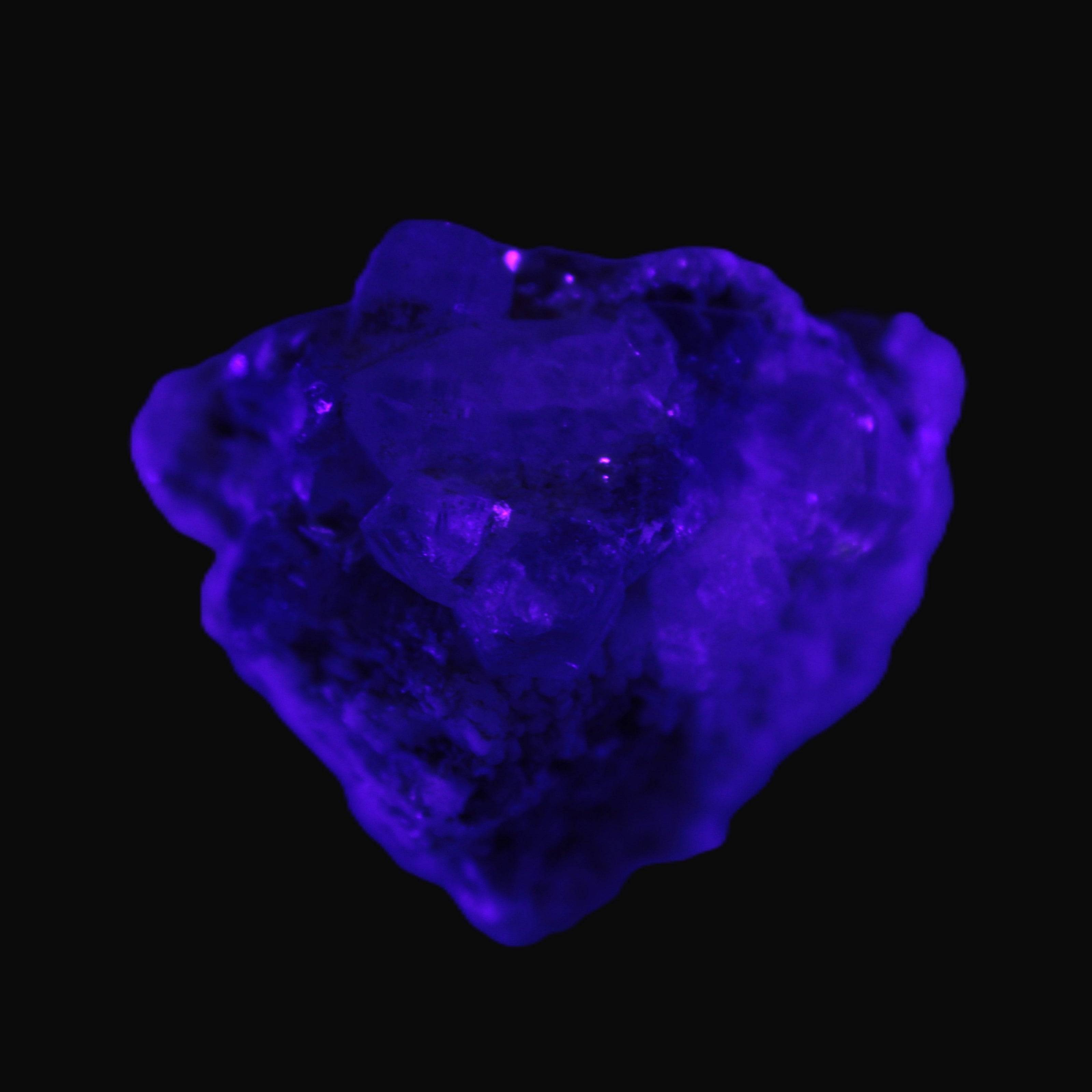 Clear Topaz crystals on matrix from Pakistan 98ct 19.5g in UV light - Rocks and Things Store