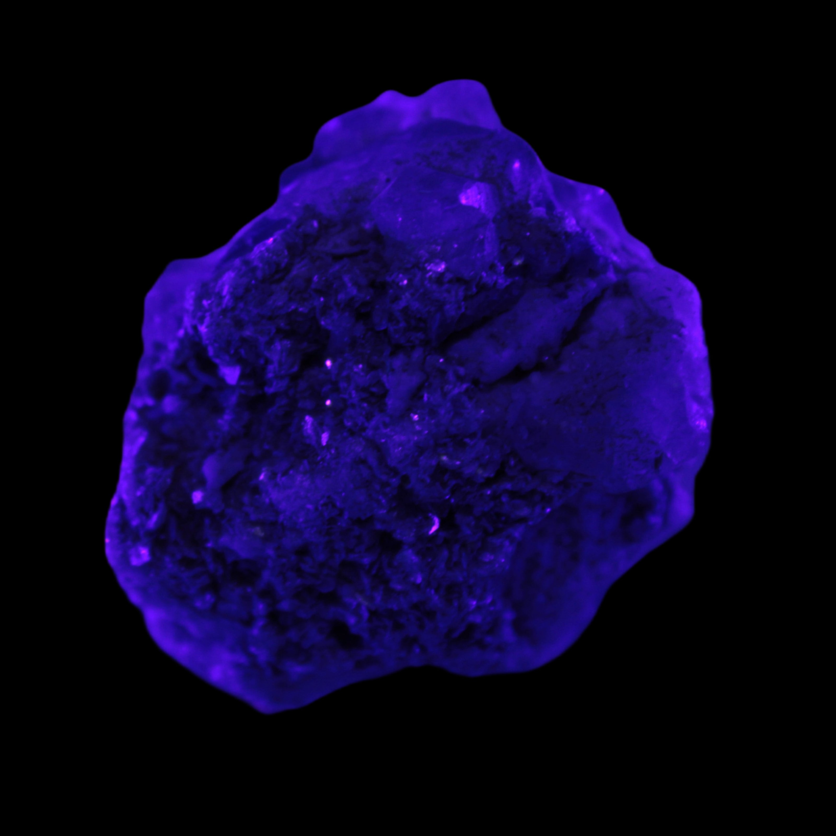 Clear Topaz crystals on matrix from Pakistan 98ct 19.5g in UV light - Rocks and Things Store