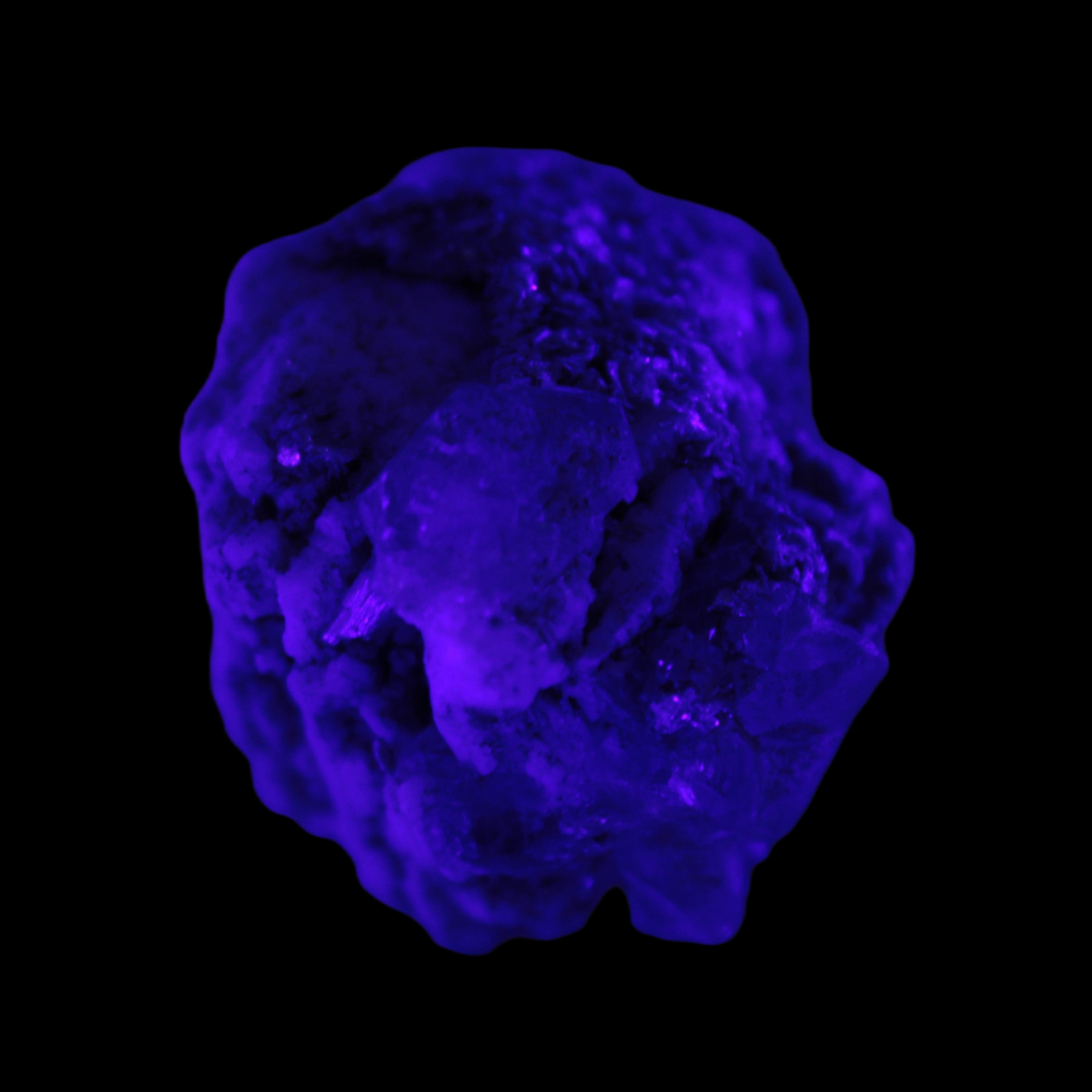 Clear Topaz crystals on matrix from Pakistan 98ct 19.5g in UV light - Rocks and Things Store