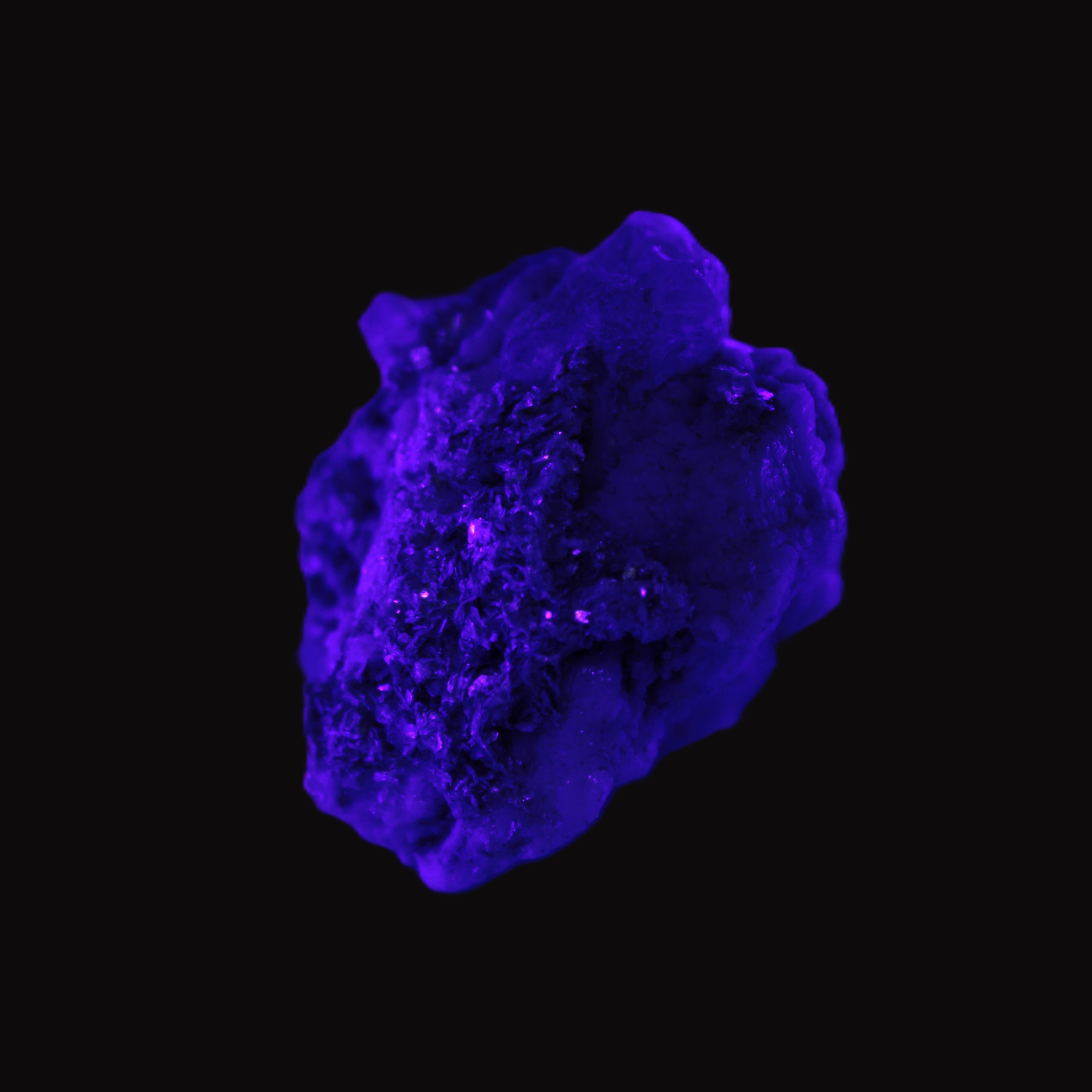 Clear Topaz crystals on matrix from Pakistan 98ct 19.5g in UV light - Rocks and Things Store