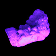 Two small clear and a tiny dark Topaz crystal on matrix from Pakistan 38.2ct 7.6g in UV light - Rocks and Things Store