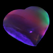Heart hand-carved in dyed Calcite from Pakistan 72*68*16mm 126.6g in UV light - Rocks and Things Store
