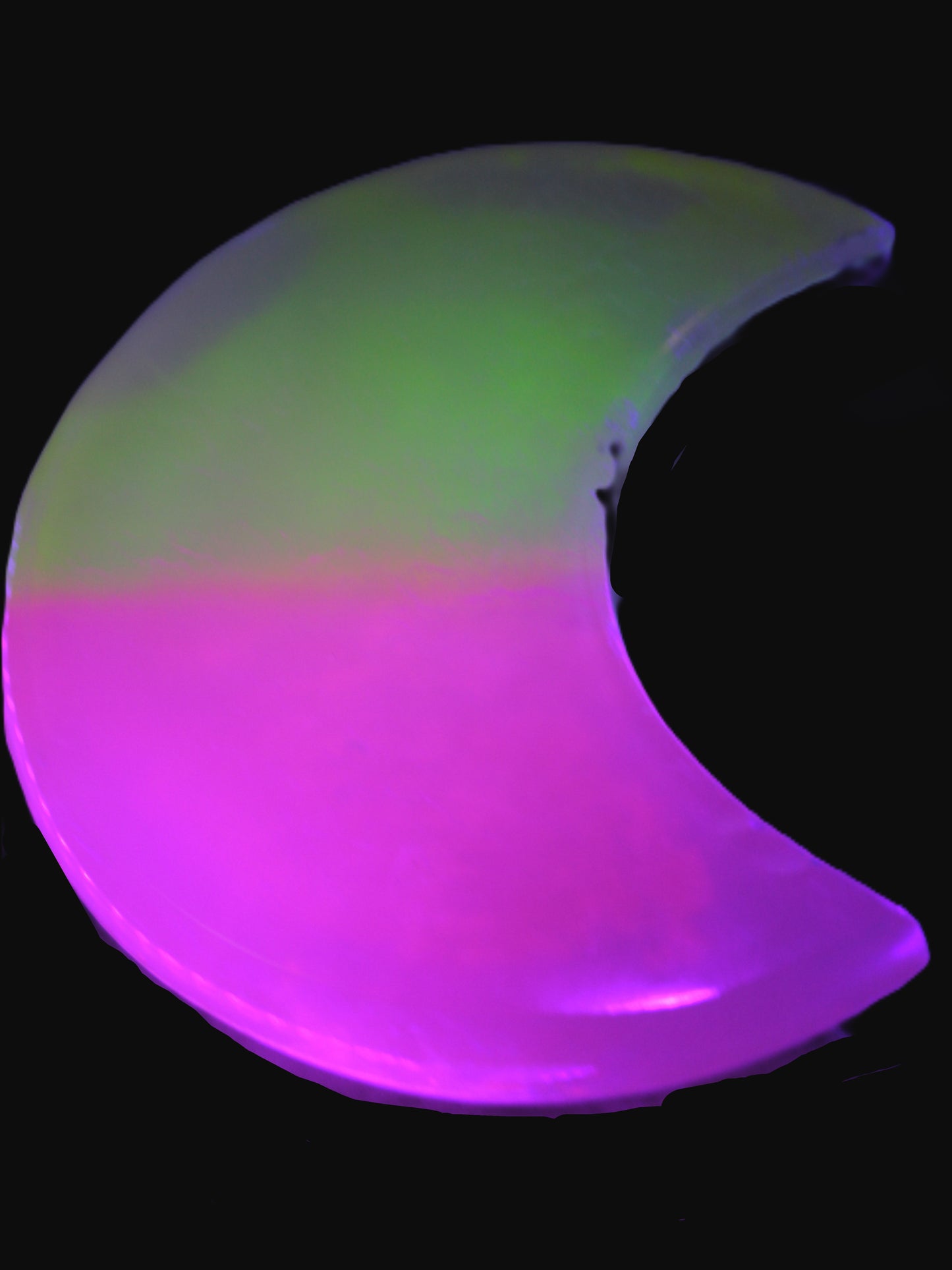 Calcite Pink and Yellow dyed crescent moon in UV light