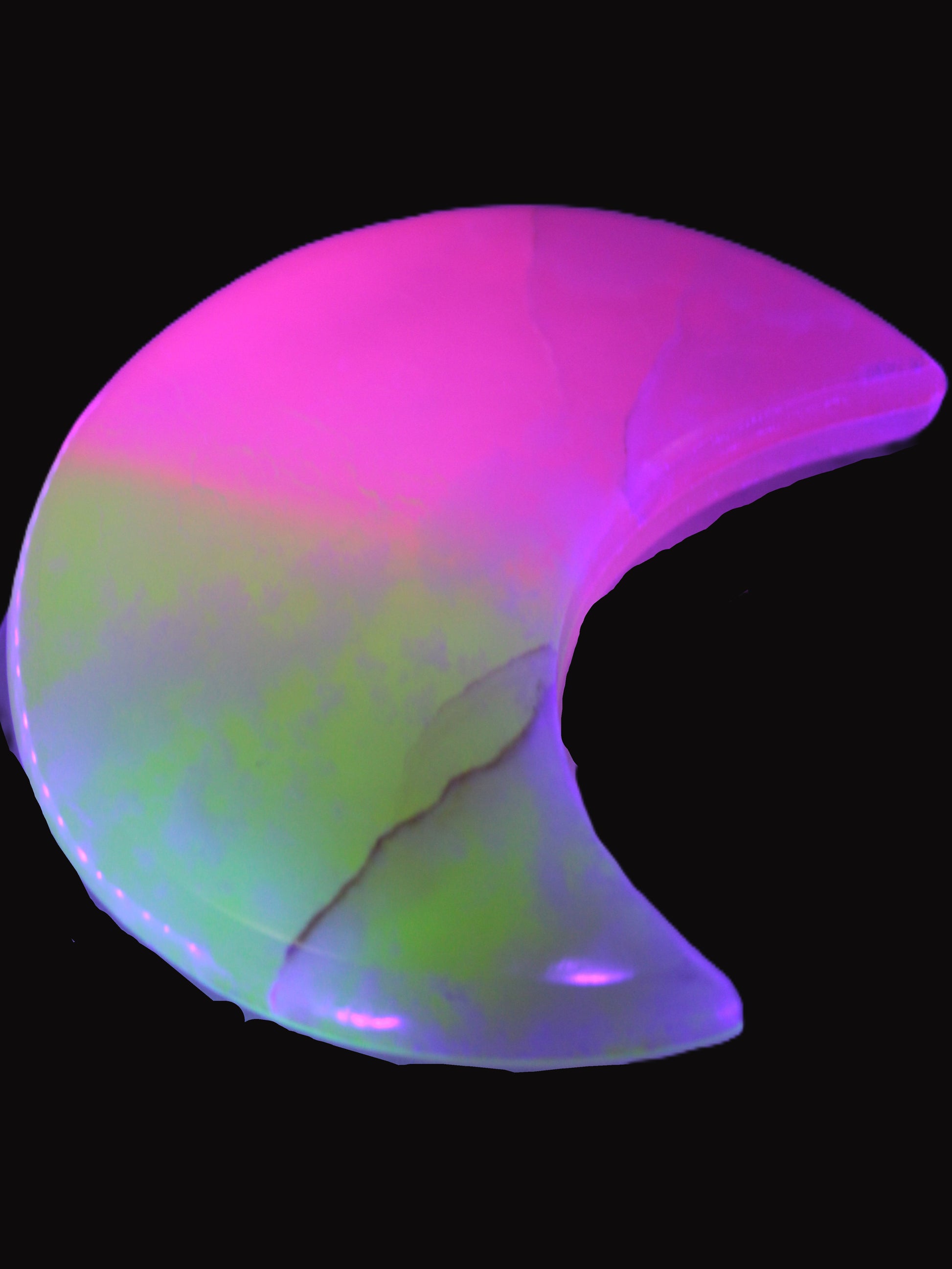 Calcite Pink and Yellow dyed crescent moon in UV light