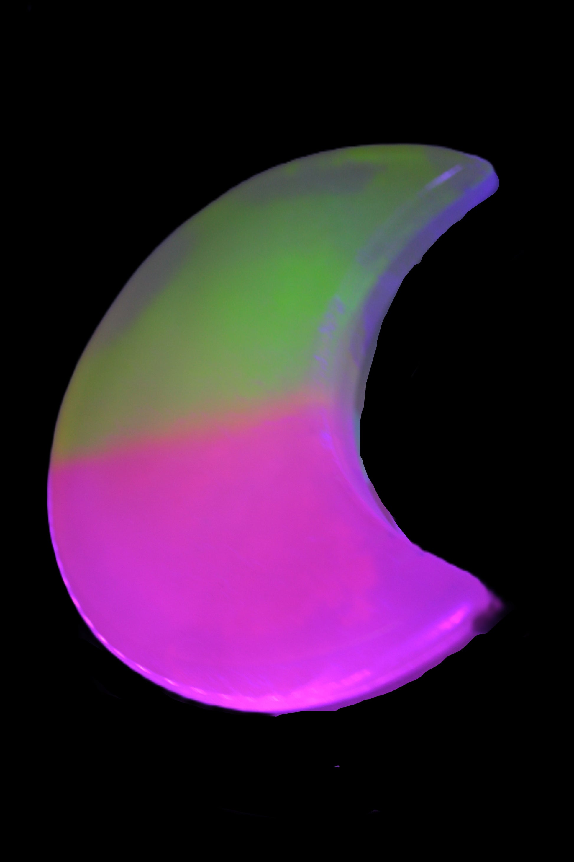 Calcite Pink and Yellow dyed crescent moon in UV light