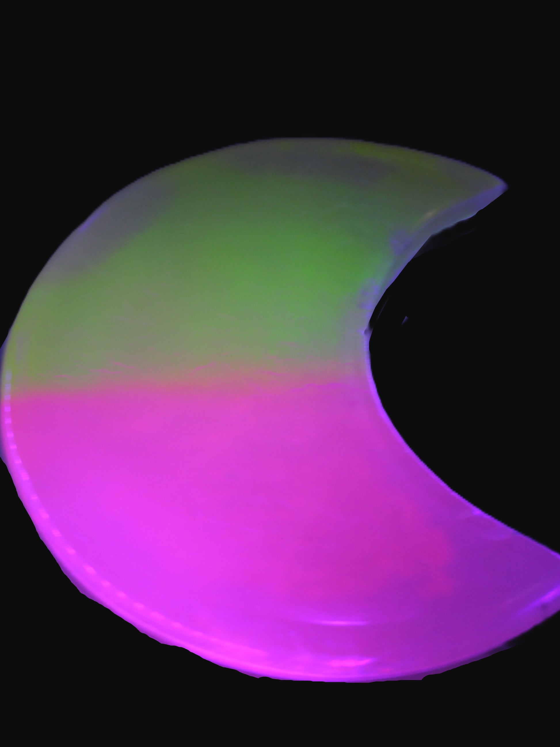 Calcite Pink and Yellow dyed crescent moon in UV light