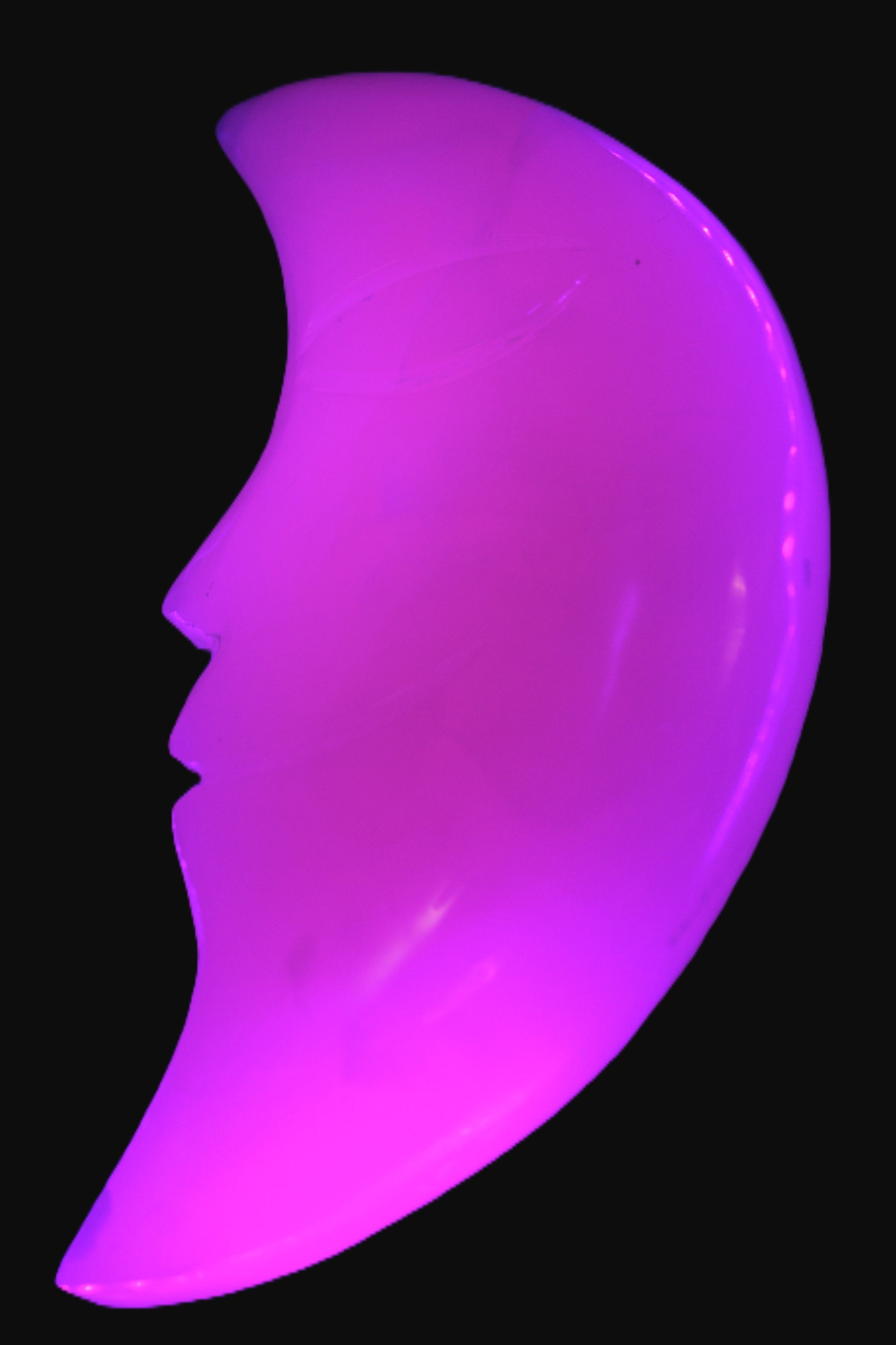 Mangano Calcite smiling Crescent Moon 70*132.22mm 331g in UV light  - Rocks and Things Store