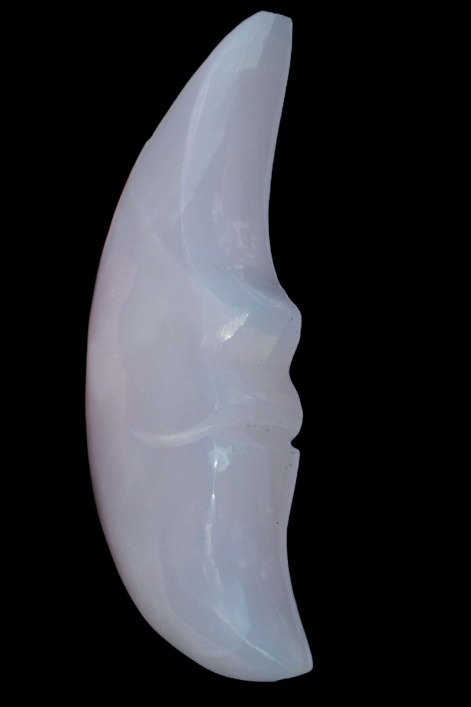 Mangano Calcite smiling Crescent Moon 70*132.22mm 331g in sunlight  - Rocks and Things Store
