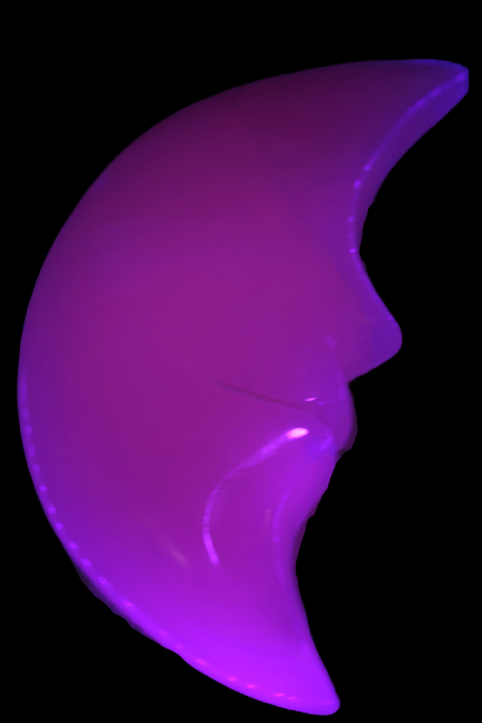 Mangano Calcite smiling Crescent Moon 70*132.22mm 331g in UV light  - Rocks and Things Store