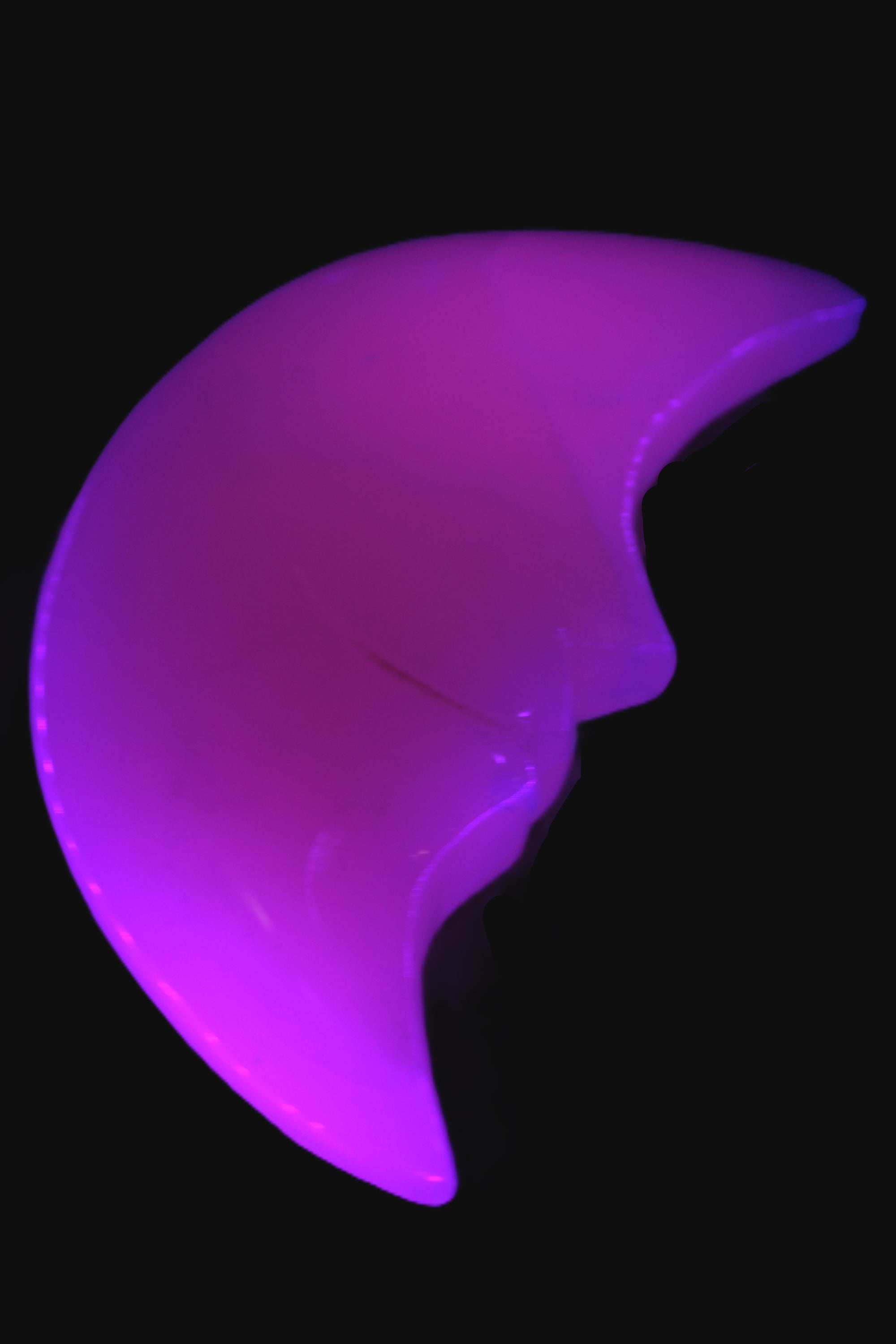 Mangano Calcite smiling Crescent Moon 70*132.22mm 331g in UV light  - Rocks and Things Store