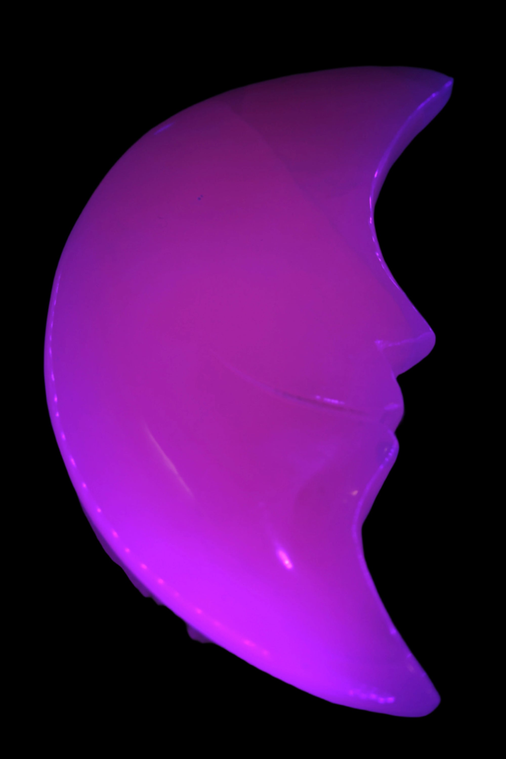 Mangano Calcite smiling Crescent Moon 70*132.22mm 331g in UV light  - Rocks and Things Store