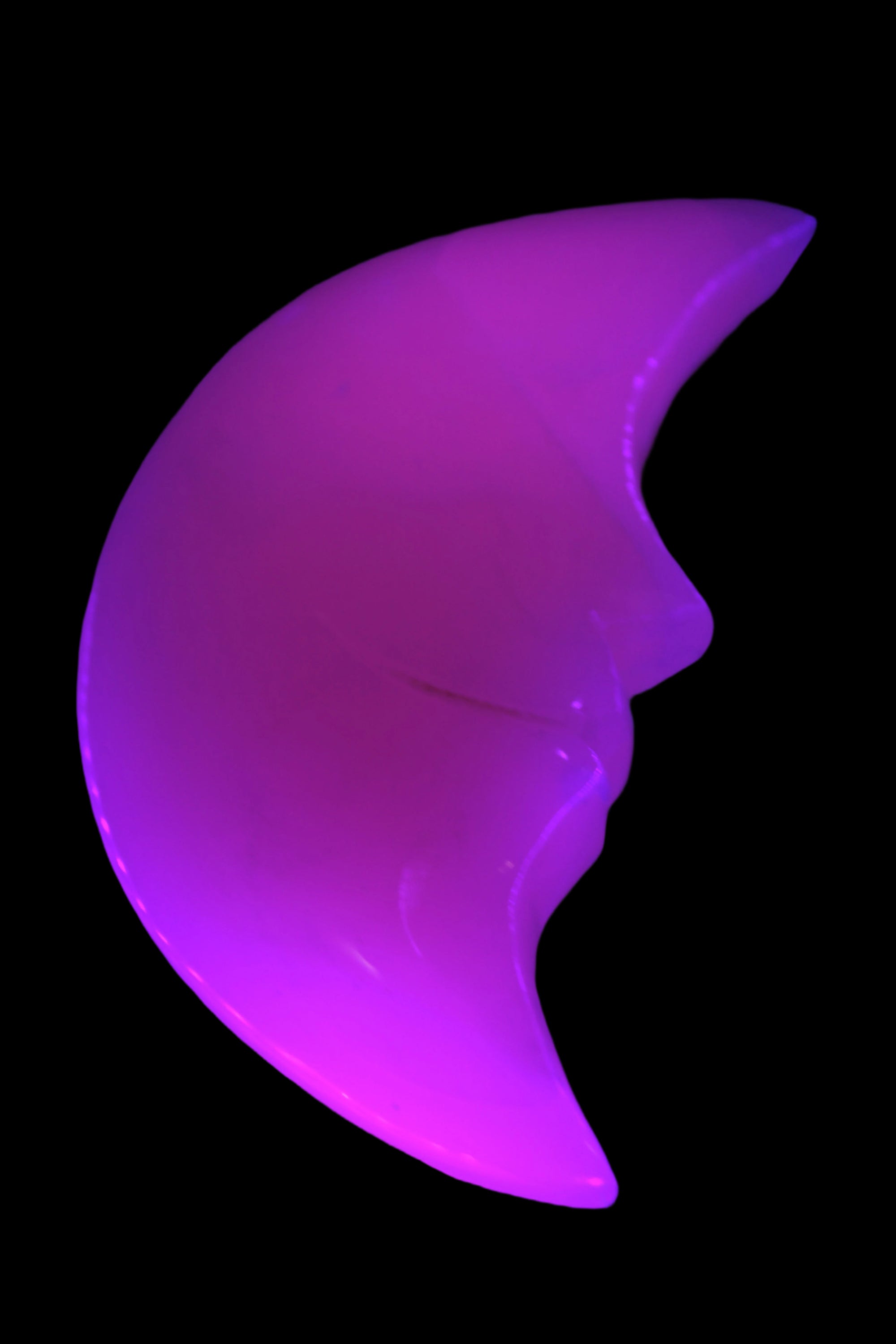 Mangano Calcite smiling Crescent Moon 70*132.22mm 331g in UV light  - Rocks and Things Store