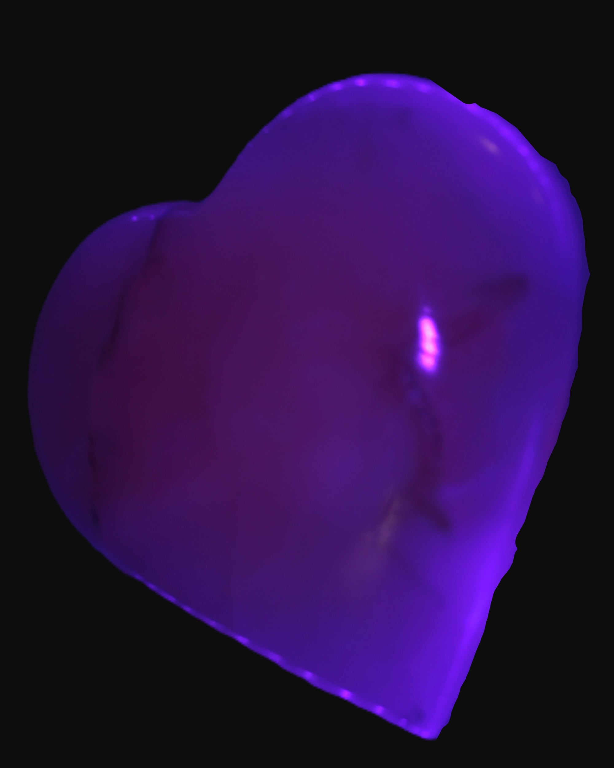 Mangano Calcite heart 38mm 20-25g  in UV light - Rocks and Things Store