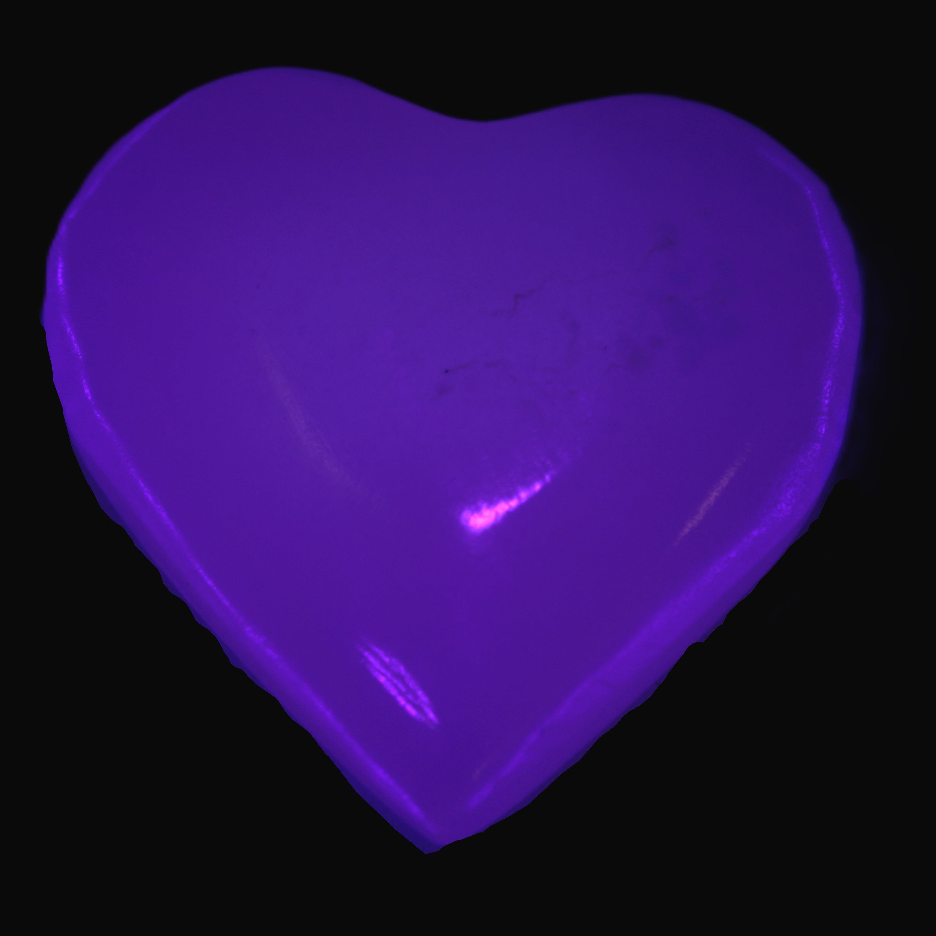 Mangano Calcite heart 38mm 20-25g  in UV light - Rocks and Things Store