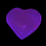 Mangano Calcite UV-reactive heart 38mm 25-30g in UV light - Rocks and Things Store