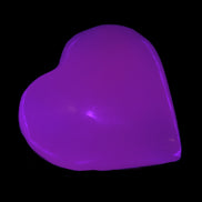 Mangano Calcite UV-reactive heart 38mm 25-30g in UV light - Rocks and Things Store
