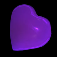Mangano Calcite UV-reactive heart 38mm 25-30g in UV light - Rocks and Things Store