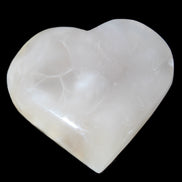 Mangano Calcite hand-carved heart 66/67*64/70mm 130-136g in sunlight - Rocks and Things Store
