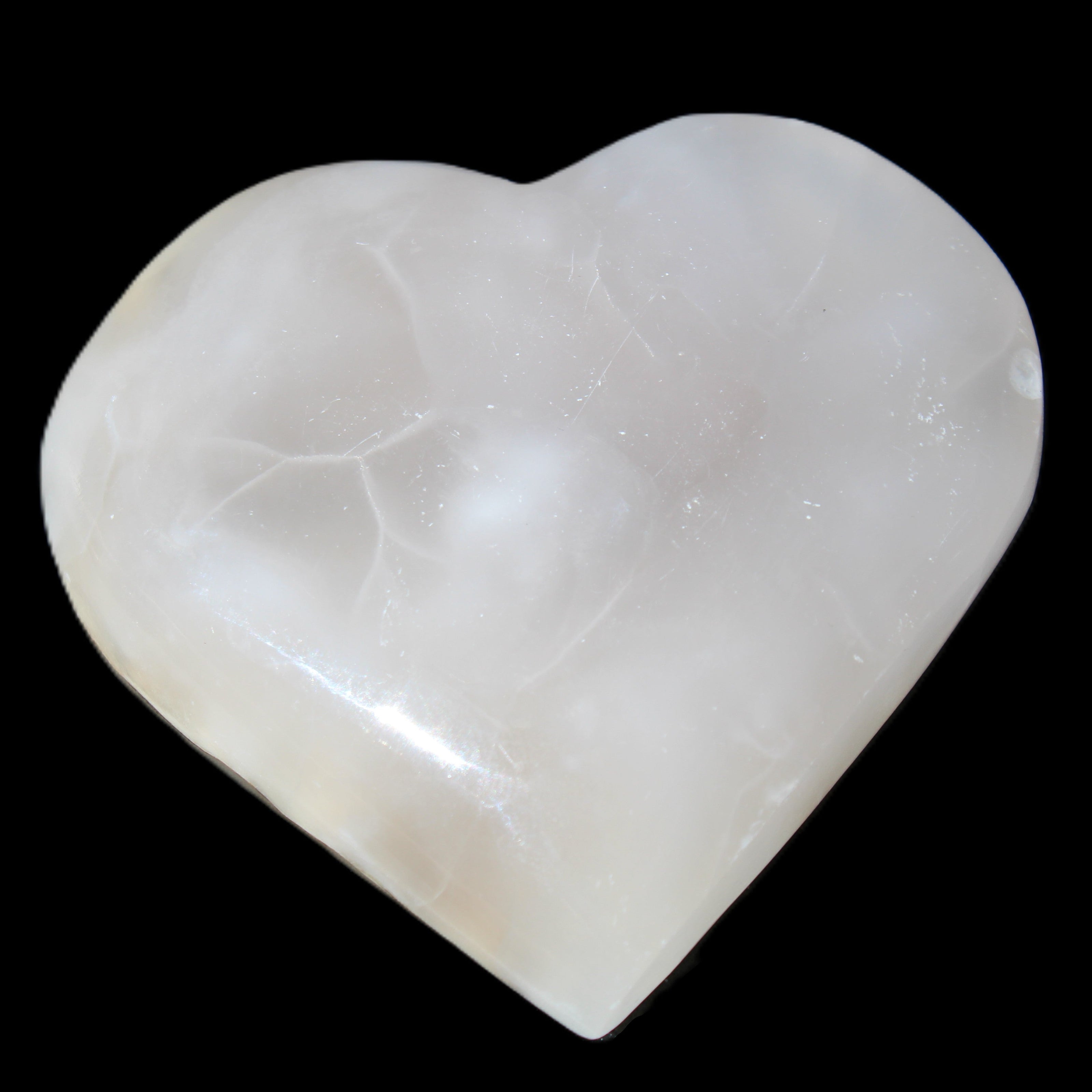 Mangano Calcite hand-carved heart 66/67*64/70mm 130-136g in sunlight - Rocks and Things Store