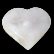 Mangano Calcite hand-carved heart 66/67*64/70mm 130-136g in sunlight - Rocks and Things Store