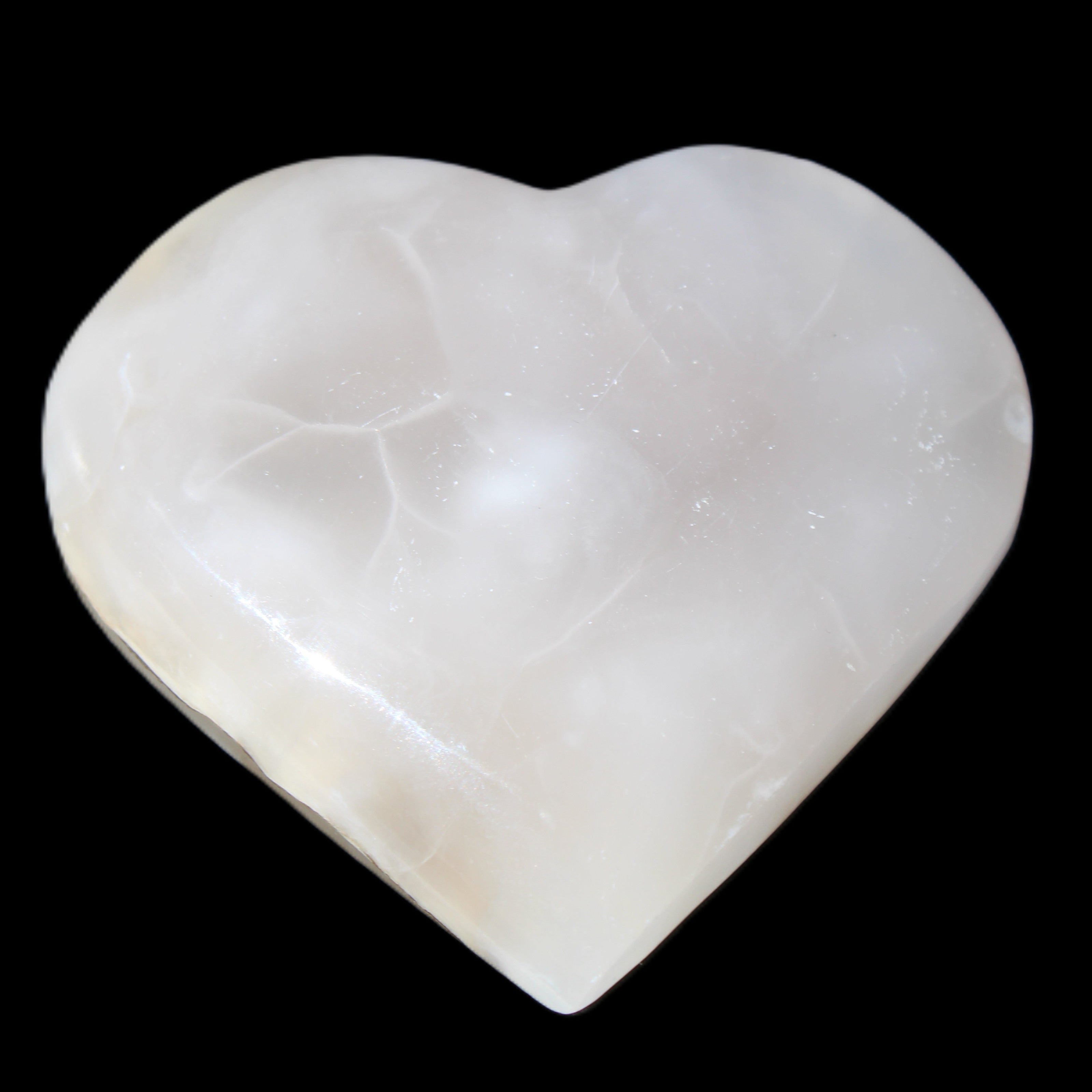 Mangano Calcite hand-carved heart 66/67*64/70mm 130-136g in sunlight - Rocks and Things Store