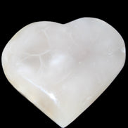 Mangano Calcite hand-carved heart 66/67*64/70mm 130-136g in sunlight - Rocks and Things Store