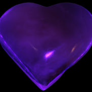 Mangano Calcite hand-carved heart 67-94mm  129-274g in UV light - Rocks and Things Store