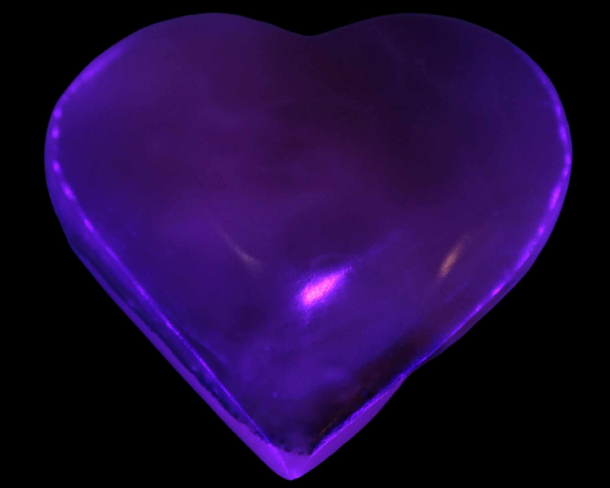 Mangano Calcite hand-carved heart 67-94mm  129-274g in UV light - Rocks and Things Store