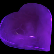 Mangano Calcite hand-carved heart 67-94mm  129-274g in UV light - Rocks and Things Store