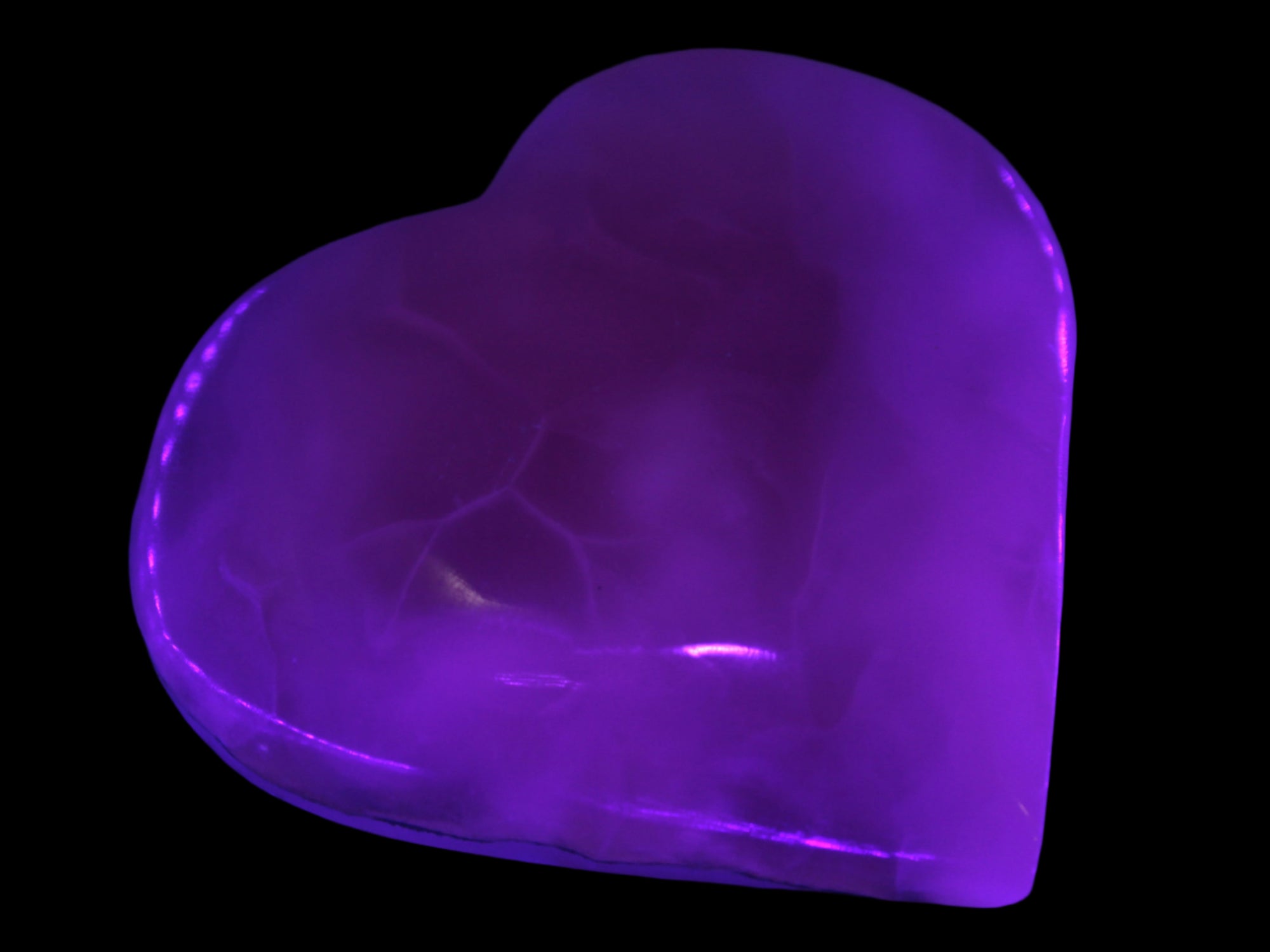 Mangano Calcite hand-carved heart 67-94mm  129-274g in UV light - Rocks and Things Store