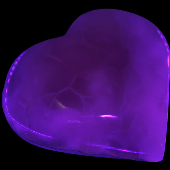 Mangano Calcite hand-carved heart 67-94mm  129-274g in UV light - Rocks and Things Store