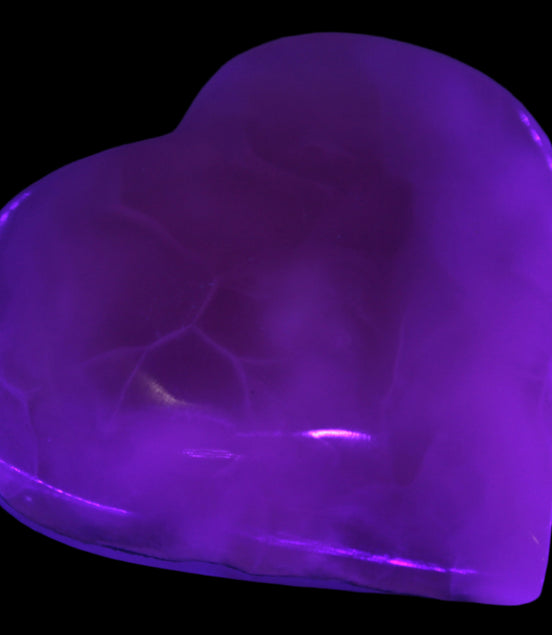 Mangano Calcite hand-carved heart 67-94mm  129-274g in UV light - Rocks and Things Store